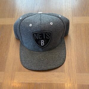 Mitchell & Ness Charcoal Brooklyn Nets snap back.